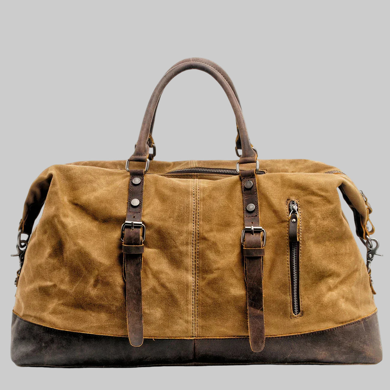 Brown leather duffel bag with straps and zippers on a white background
